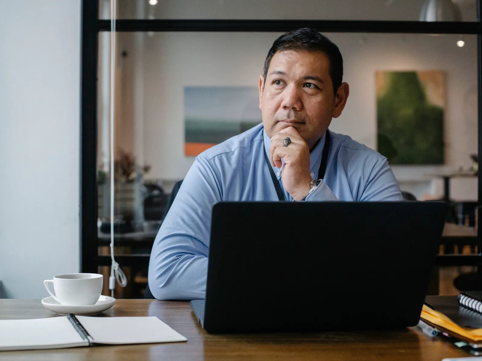 A solar company owner at his laptop, waiting for an inquiry